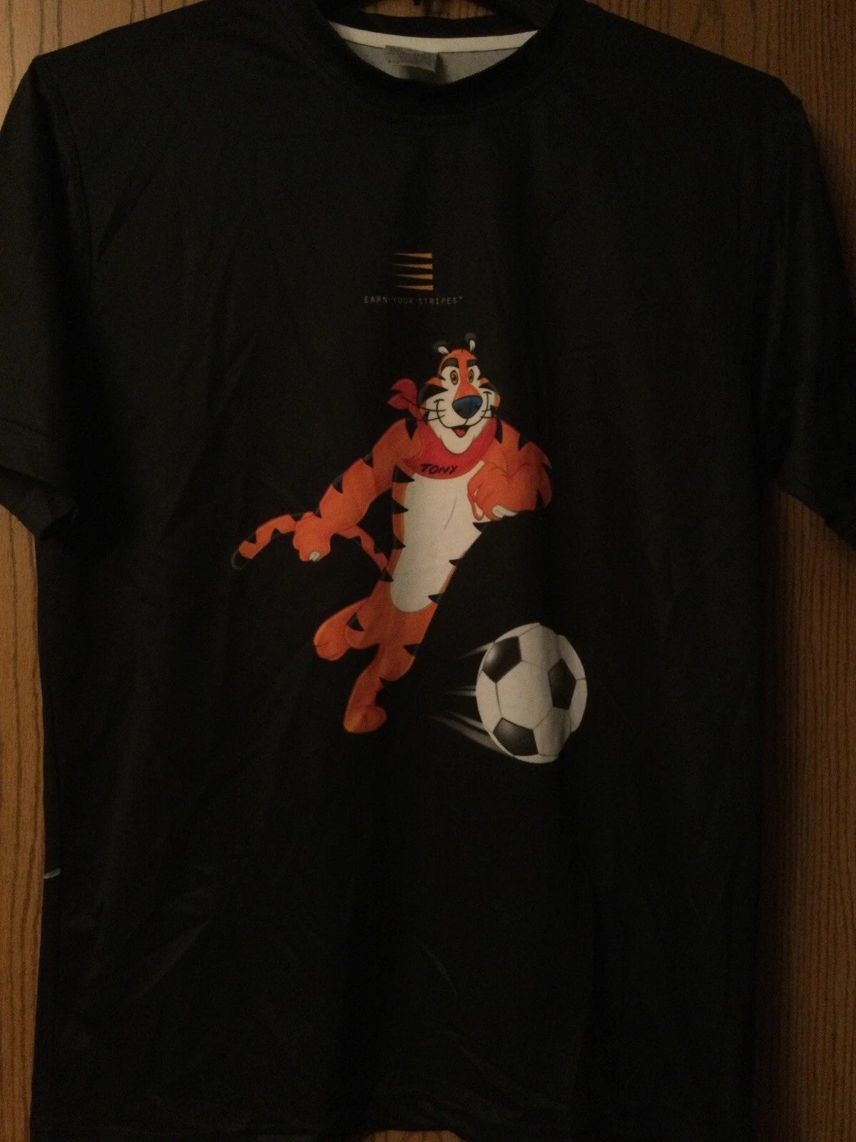 Tony The Tiger (Playing Soccer) - “Earn Your Stripes”- 2008 Black Shirt -Adult M