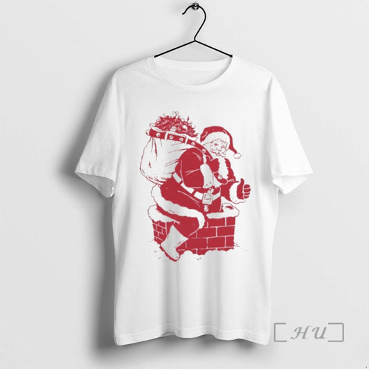 Trending Santa Claus Climbs Into The House Through The Chimney Merry Christmas Premium T Shirts - clothing by TeeHivey.com