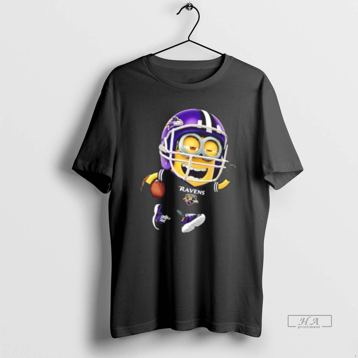 Trendy Minions Is Holding A Ball And Smiling At Baltimore Ravens - clothing by TeeHivey.com